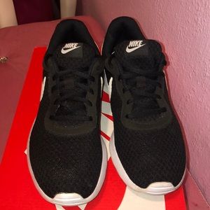 Black and white Nike Tanjun shoes